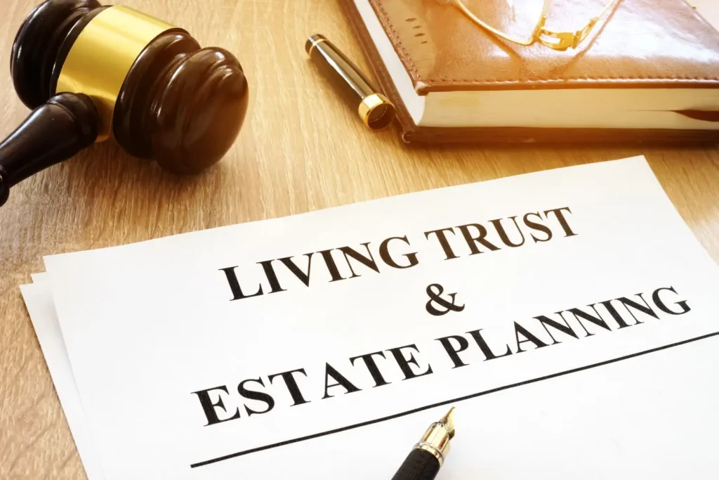 A document titled "Living Trust & Estate Planning" rests on a desk with a gavel, brown notebook, and eyeglasses—symbolizing embracing the future with estate planning and securing your legacy.