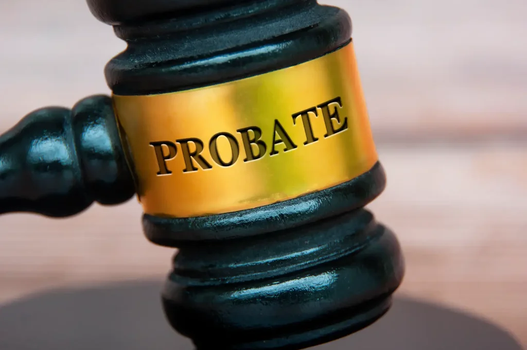 A close-up of a judge's gavel with a gold band engraved with the word "PROBATE," symbolizing legal authority in Probate SC.
